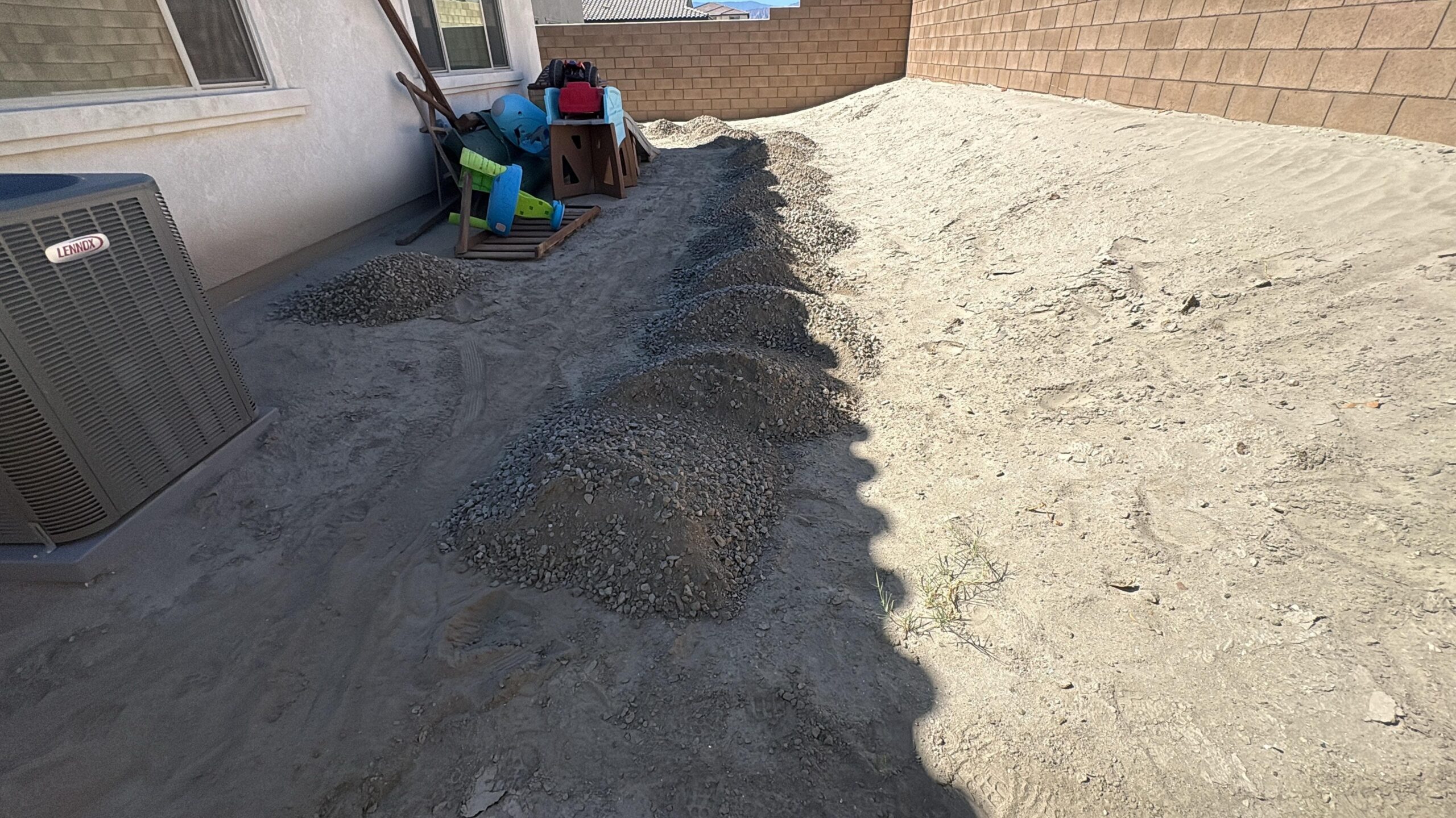 Dirt side yard before pavers